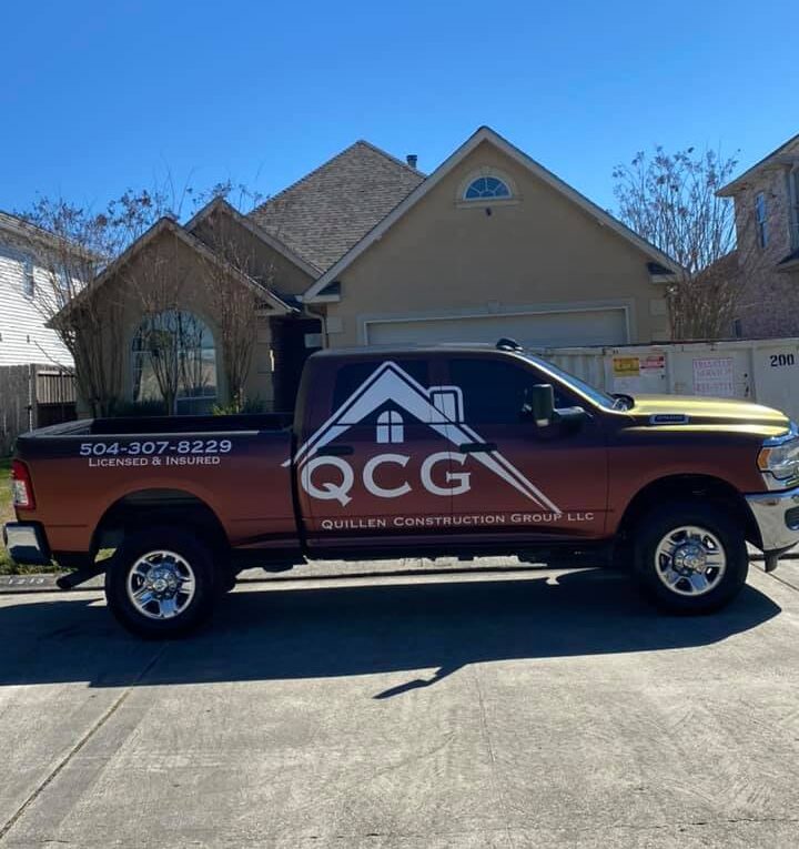 QCG truck with banner - Quillen Construction Group