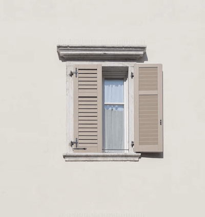 Image of window with shutters.