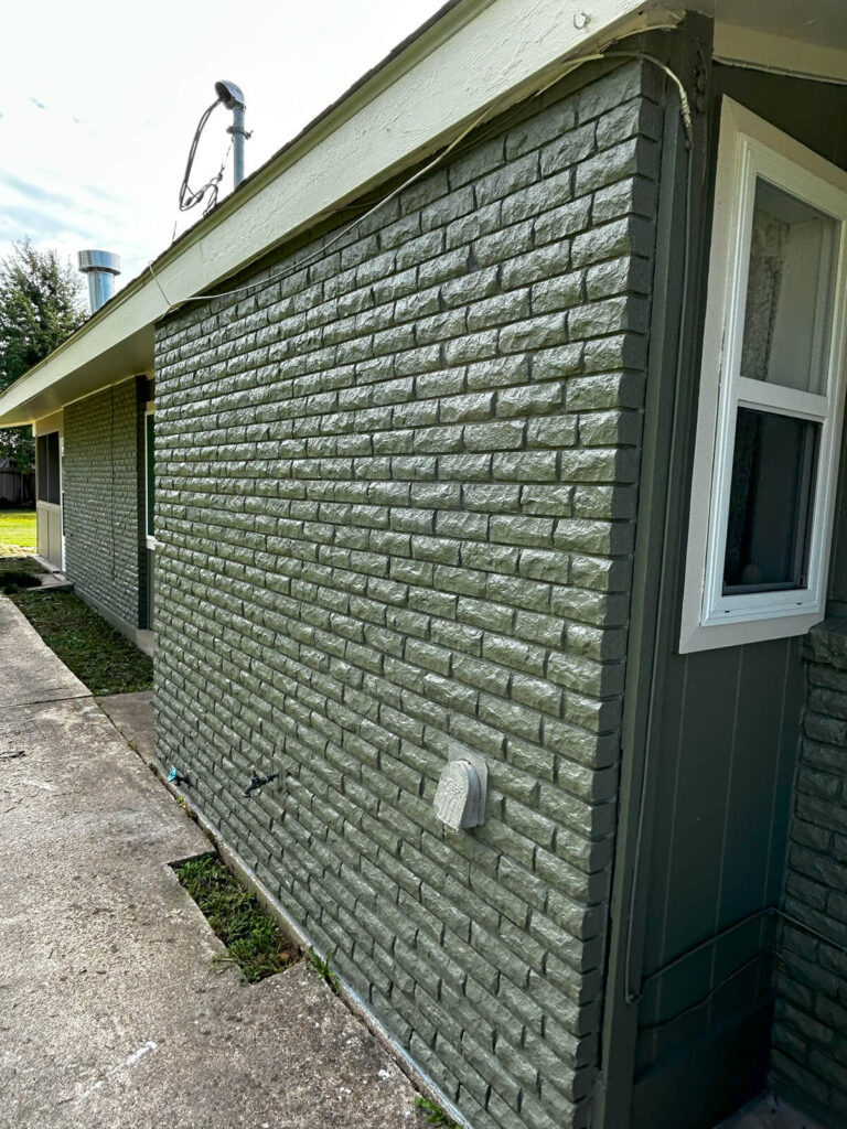 An after picture of a home, after undergoing exterior painting in New Orleans by Quillen Construction Group.