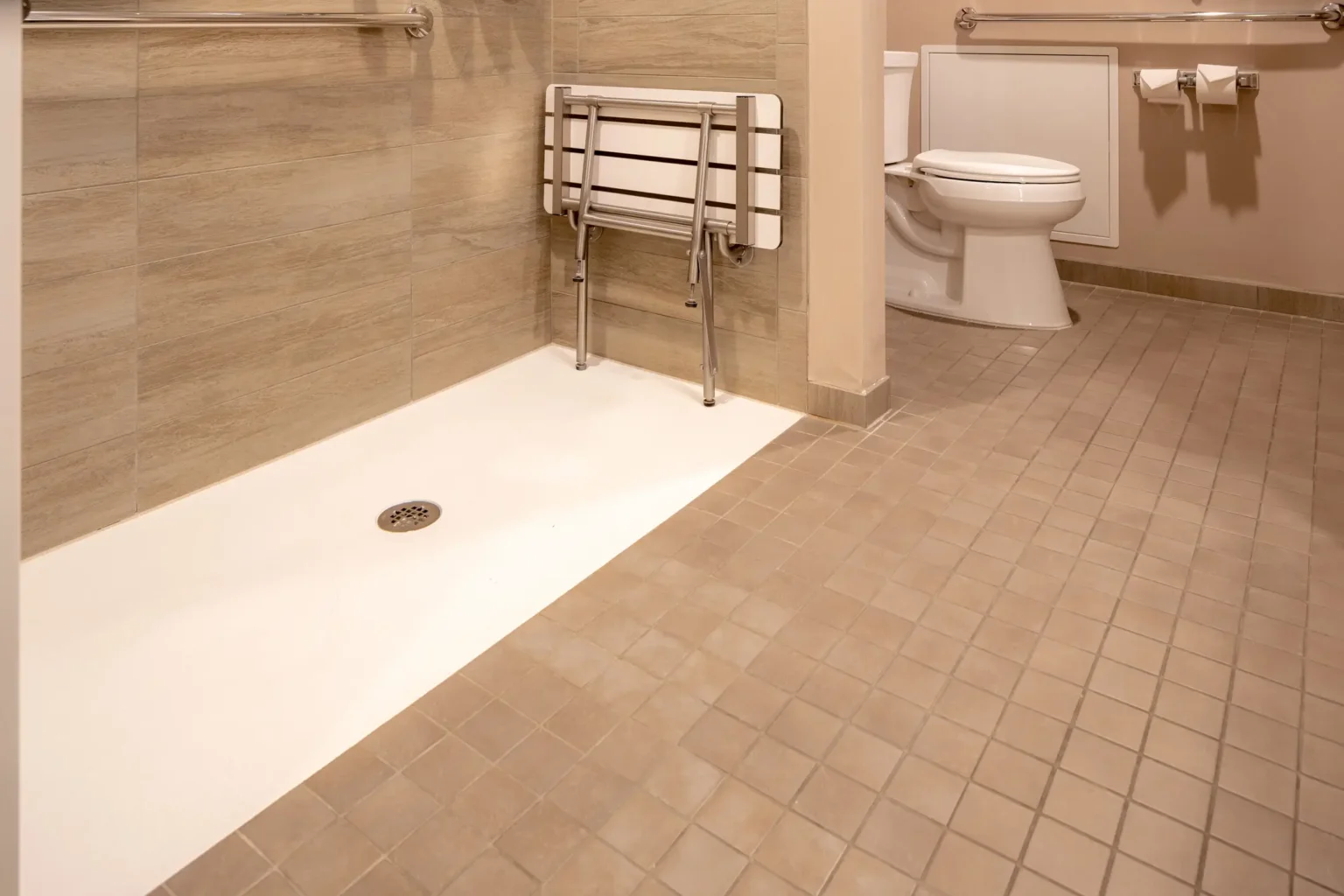 A picture of an ADA compliant bathroom, with a shower and toilet